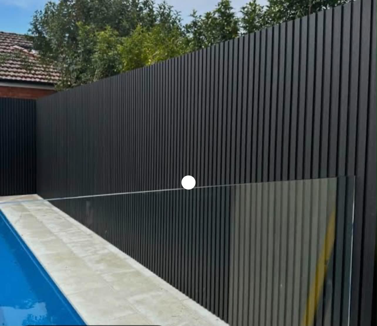 Automated sliding aluminium driveway gate installed by Sydney Fence Group